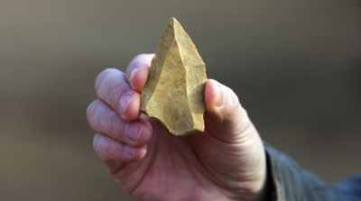 A-Man-Presents-A-Neanderthal-Flint-Head-Afp