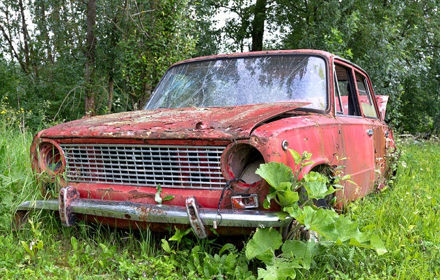 Abandoned old car in a meadow